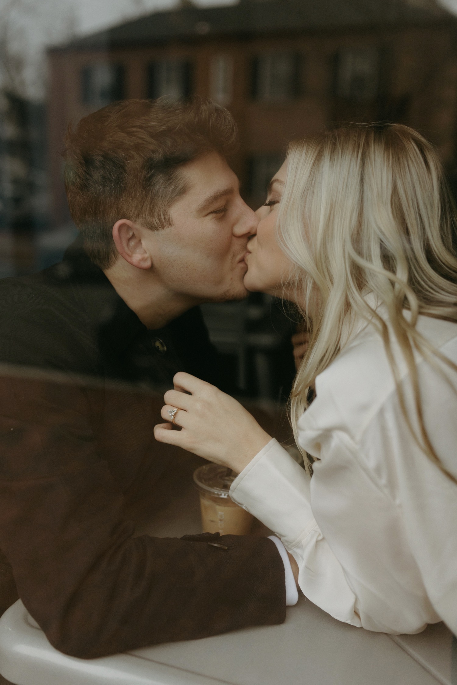 couple kissing for engagement session