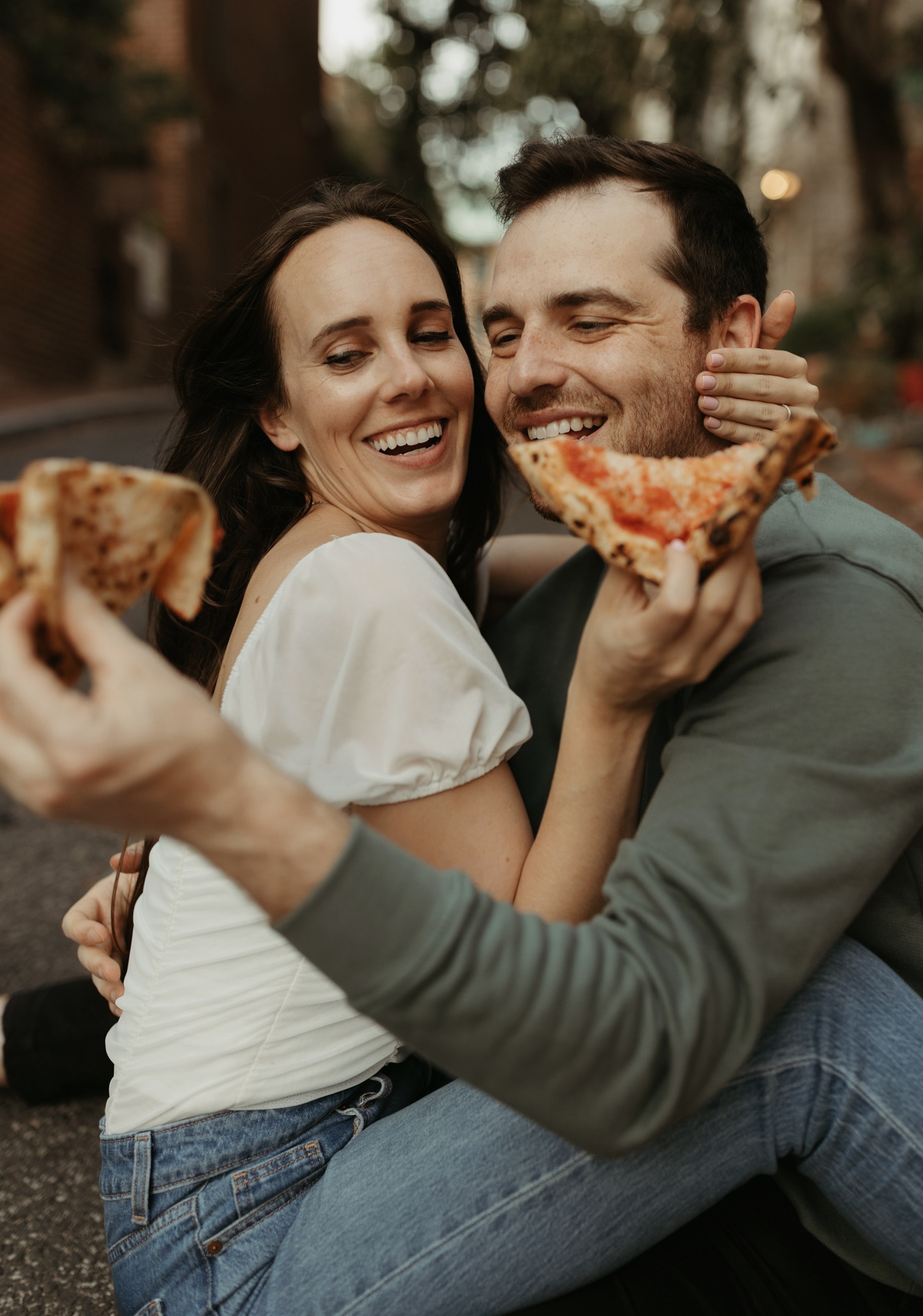 couple eating pizza for DC engagement photos