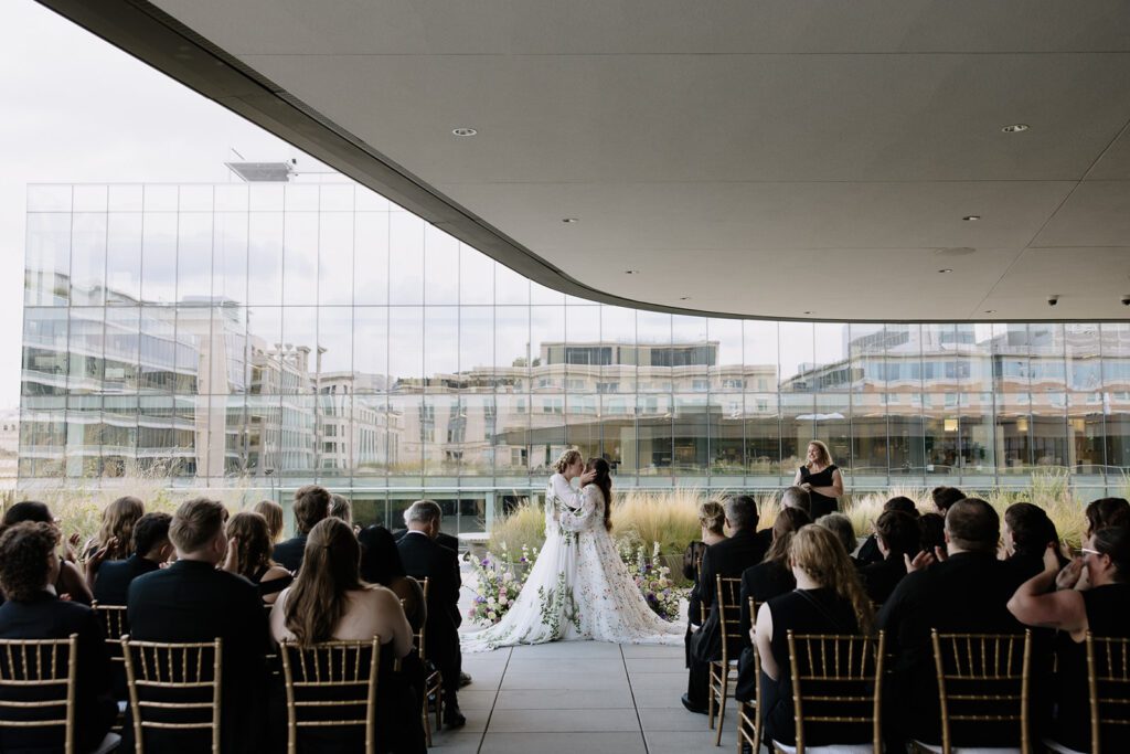 LGBTQ brides kissing at the MLK library in Washington dc