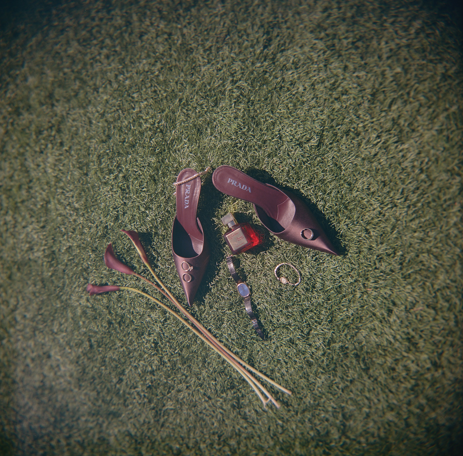 A wedding day flat lay with florals and wedding shoes