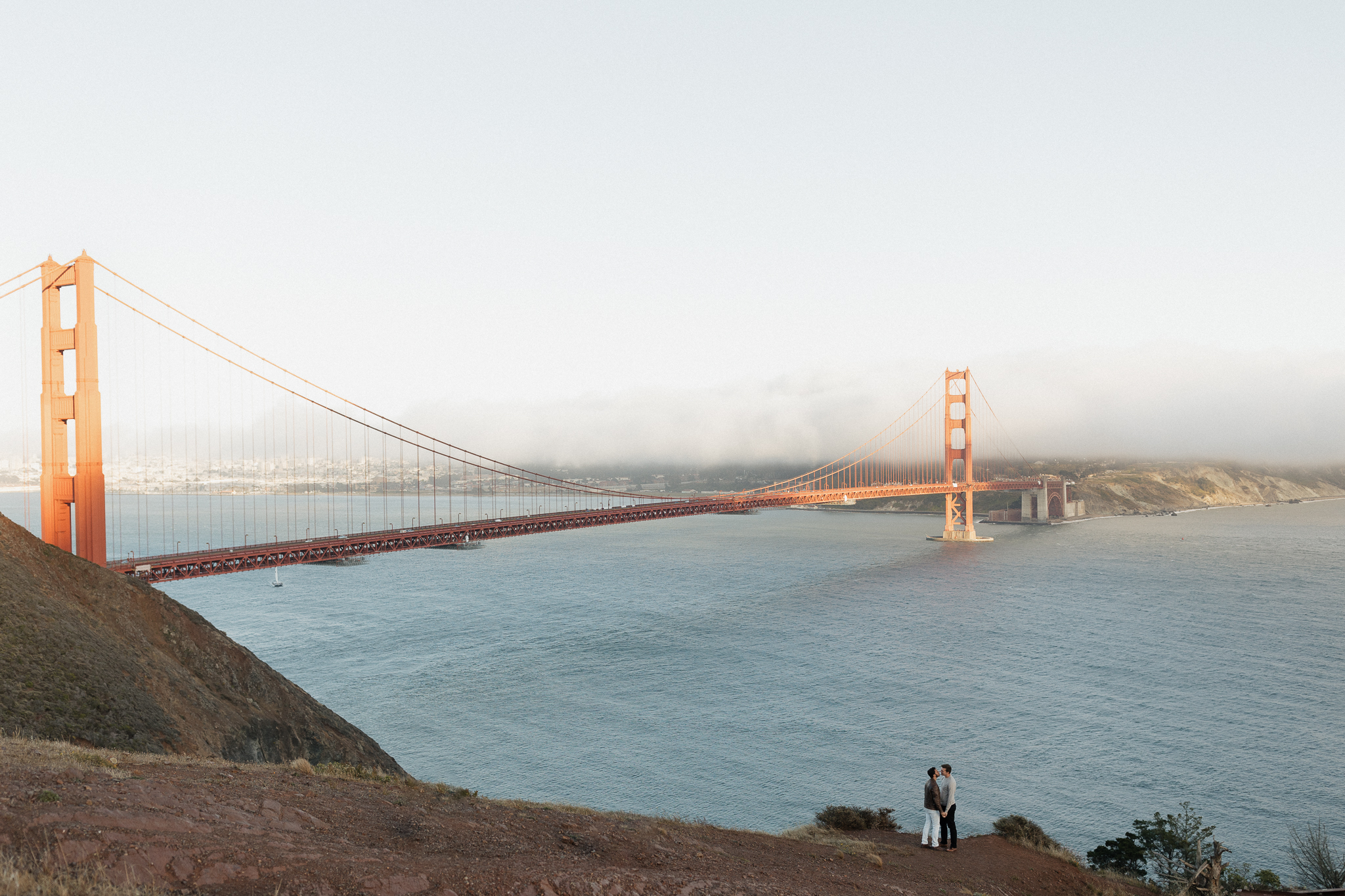 LGBTQ Couple admiring the Golden Gate Bridge.