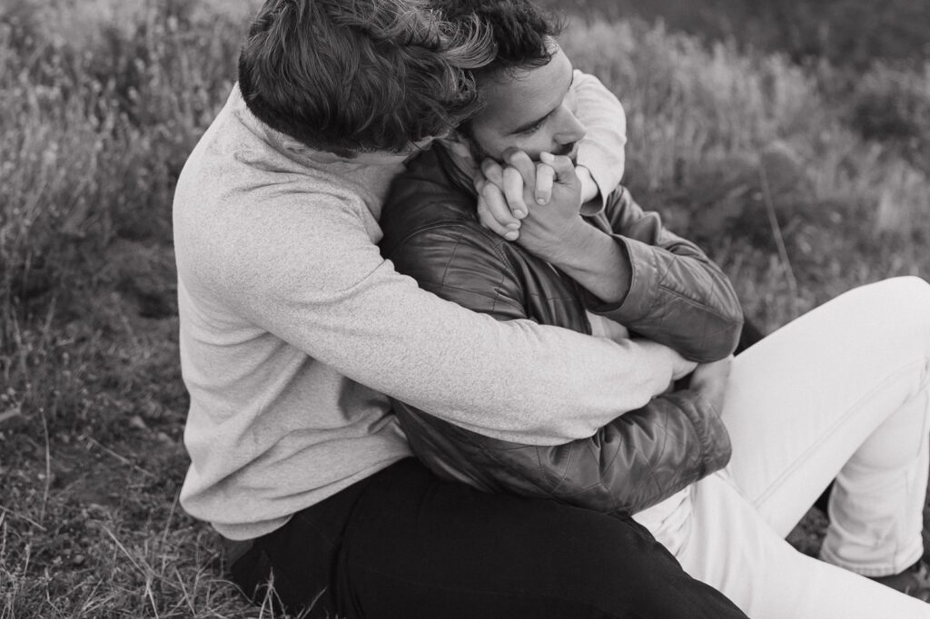 Couple embracing with Golden Gate Bridge in background