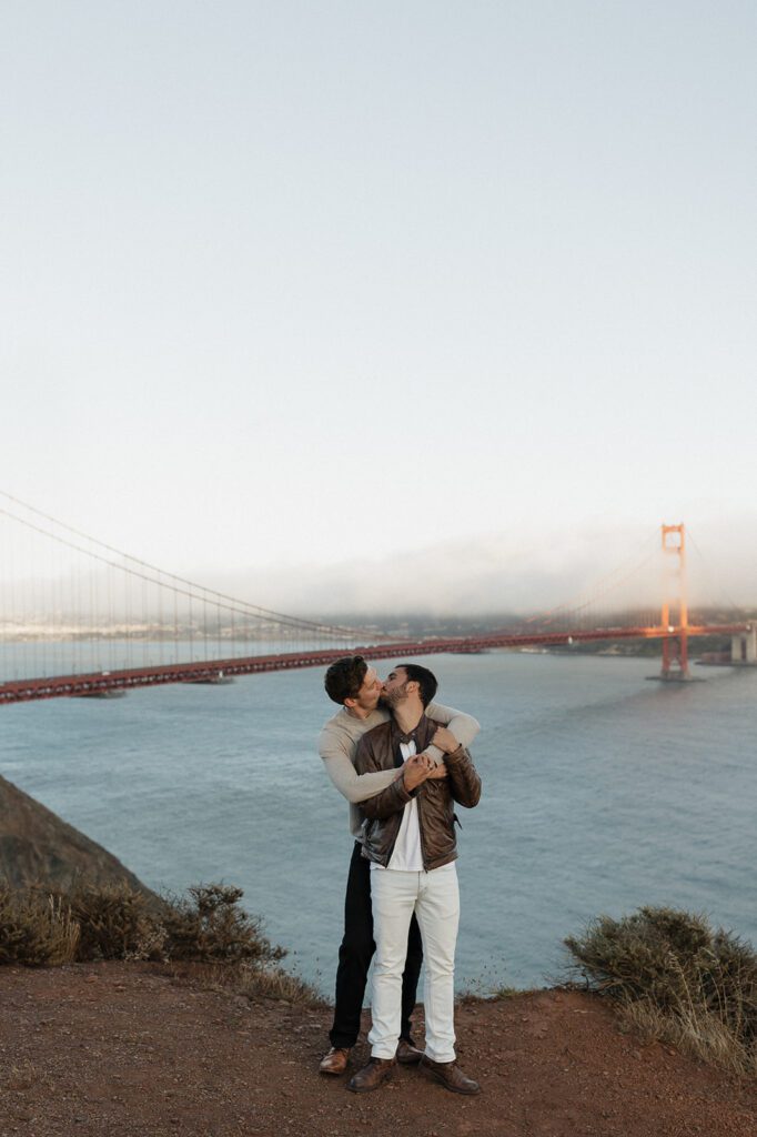LGBTQ Couple embracing with Golden Gate Bridge in background