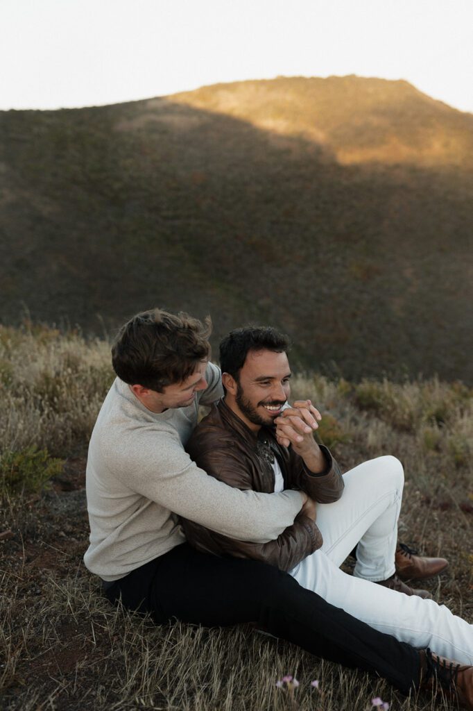 LGBTQ Couple embracing with Golden Gate Bridge 