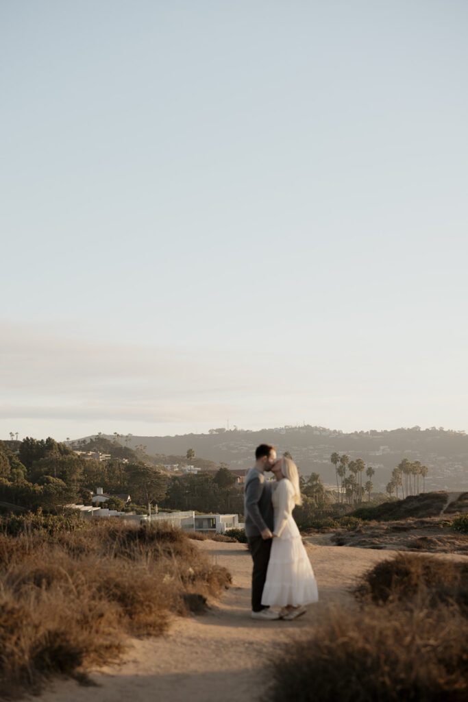 Couple kissing in engagement session.
