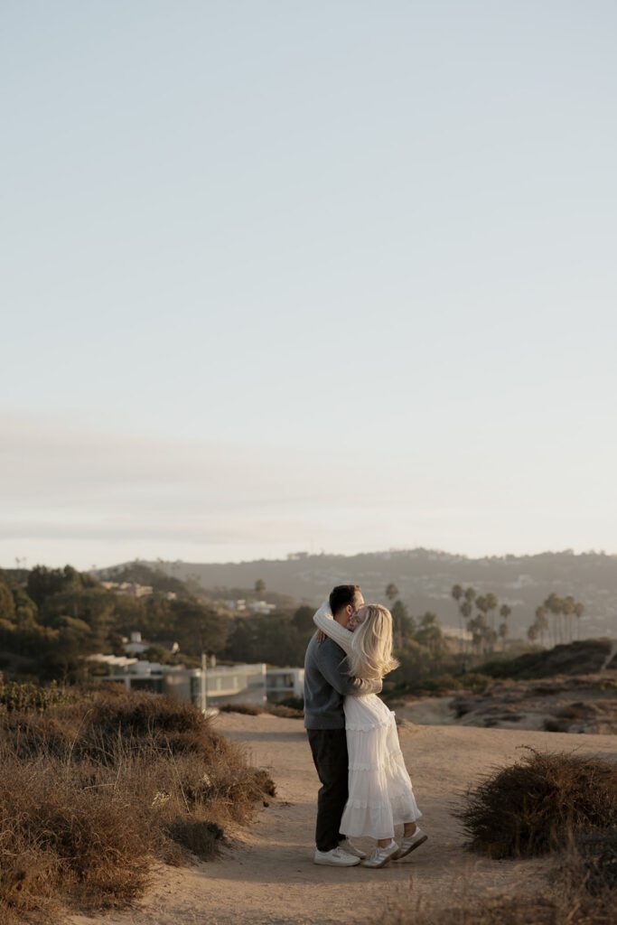 Couple during their engagement session at the beach.