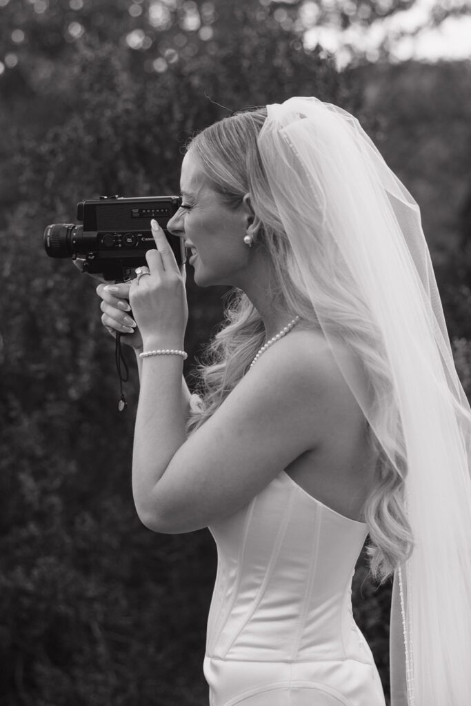 Bride using a super 8 film camera.