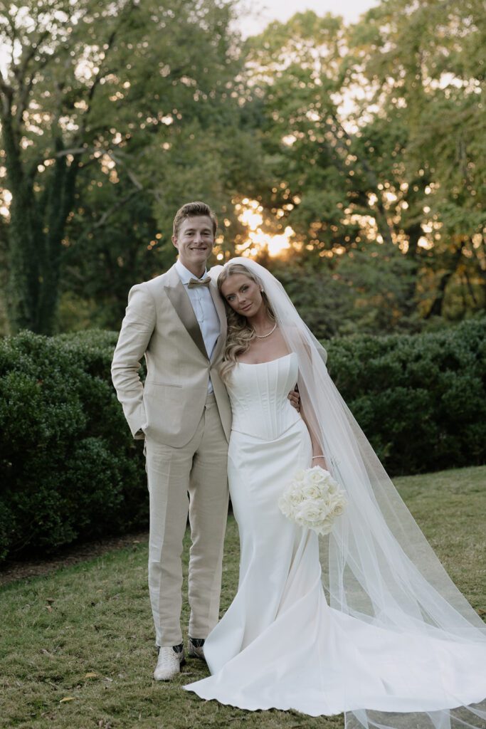 Bride and groom posing for their wedding portraits.