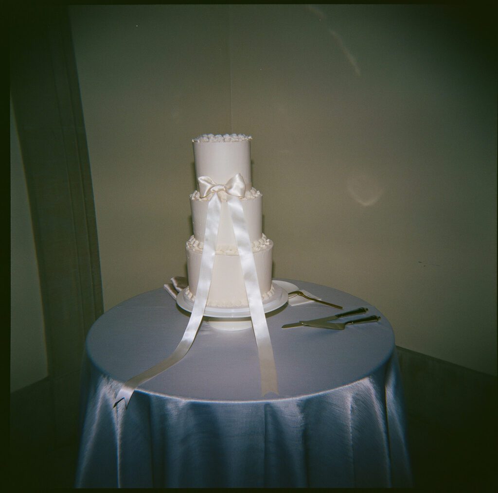A wedding cake with a bow.