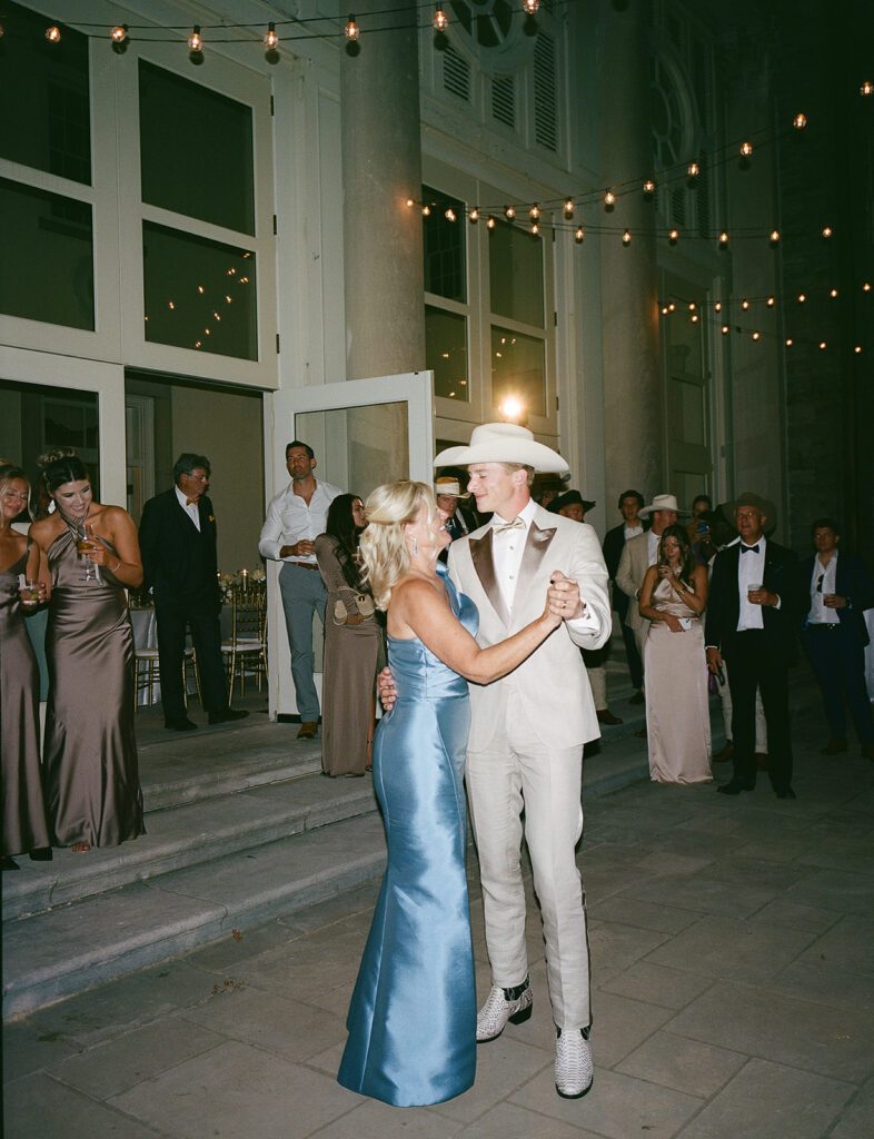Groom dancing with his mom on his wedding day.