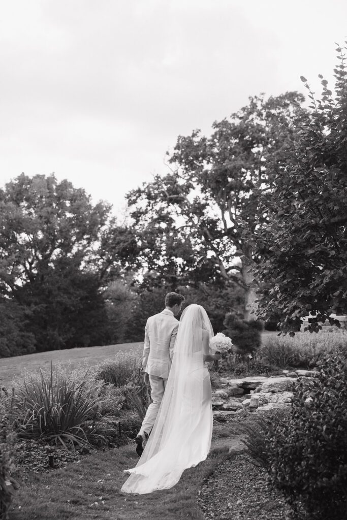 A bride and groom walking out of their ceremony as husband and wife.