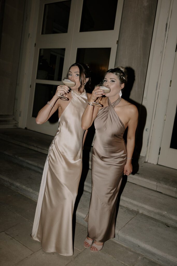 Bridesmaids drinking espresso martinis on the wedding day.