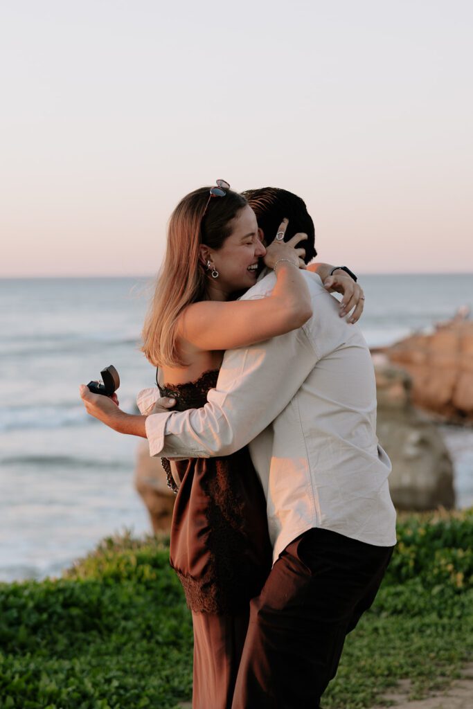Golden hour light illuminating Emmanuel and Camila in San Diego