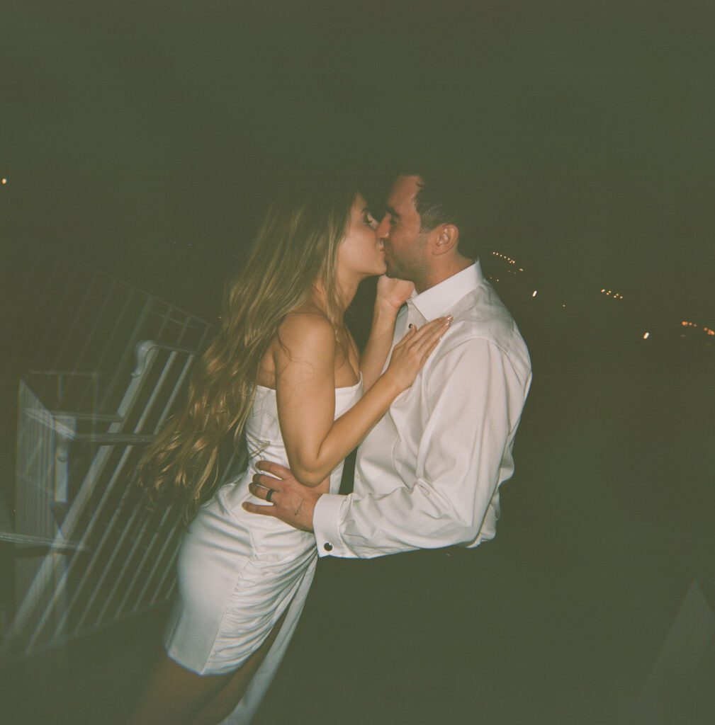 Bride and groom kissing at their wedding