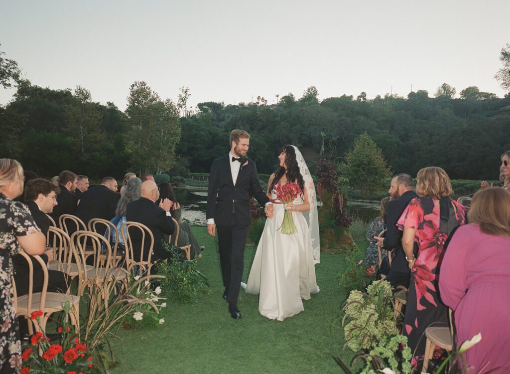 Bride and groom walking down the aisle at Monserate winery wedding