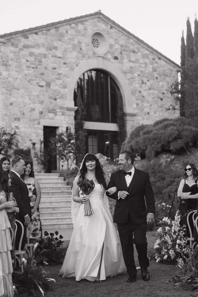 Dad looking at bride during her wedding ceremony