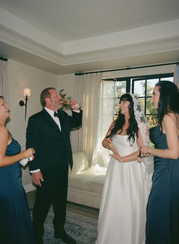 Bride and her family laughing while getting ready at Monserate