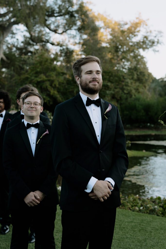 Groom looking at the bride in wedding ceremony