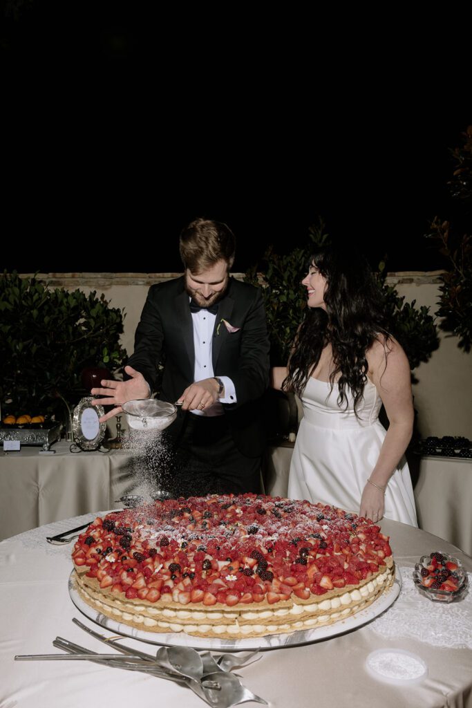 Couple cutting wedding cake at Monserate Winery wedding reception