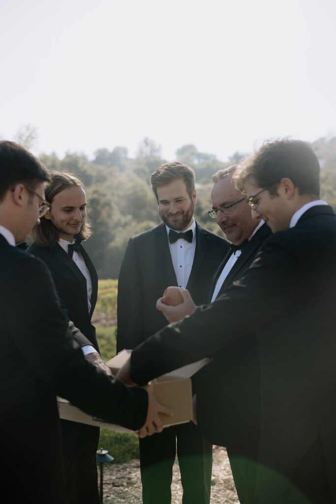 Groom getting ready for Monserate Winery wedding day in Fallbrook California