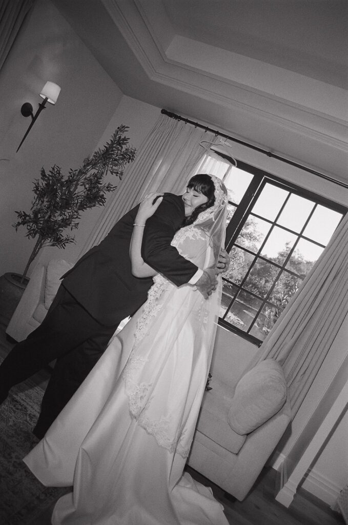 Bride with her dad during their first look at Monserate Winery wedding morning