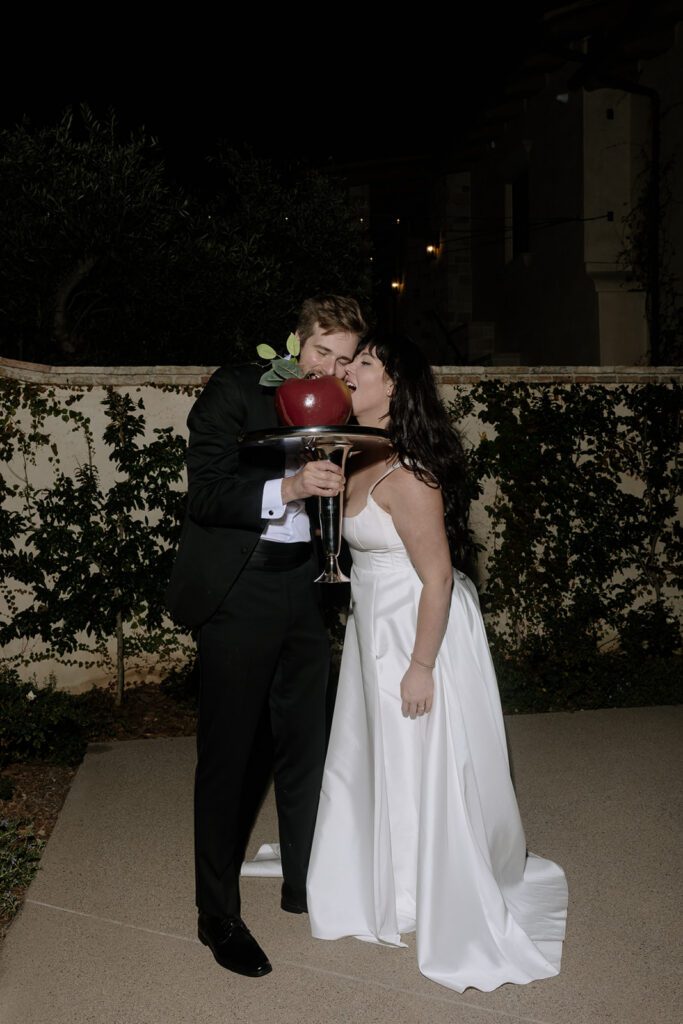 Couple enjoying desserts together during Monserate Winery wedding reception