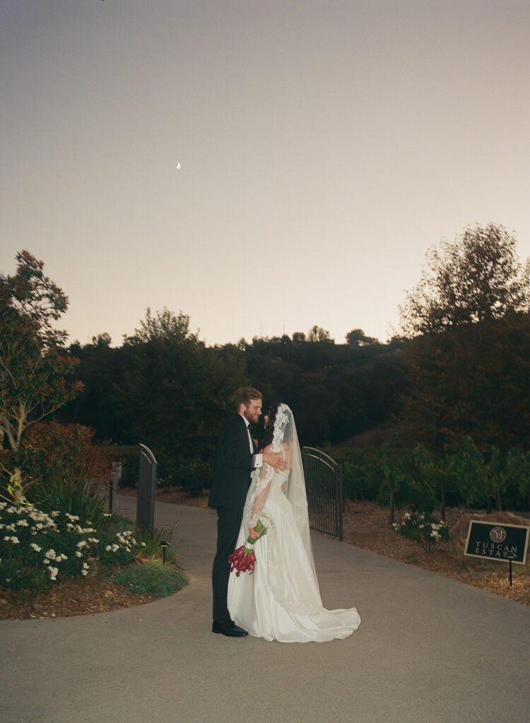Bride and groom at dusk in Monserate wedding 